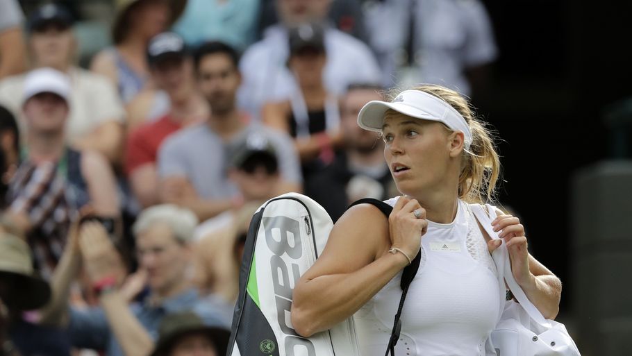 Regn kom i vejen for Caroline Wozniackis første kamp i Montreal. Dette foto er taget under Wimbledon i juli. Foto: AP